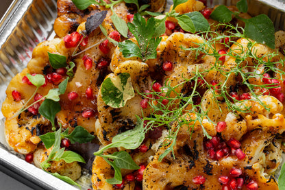 Miso roasted cauliflower steak, pomegranate & fresh herbs