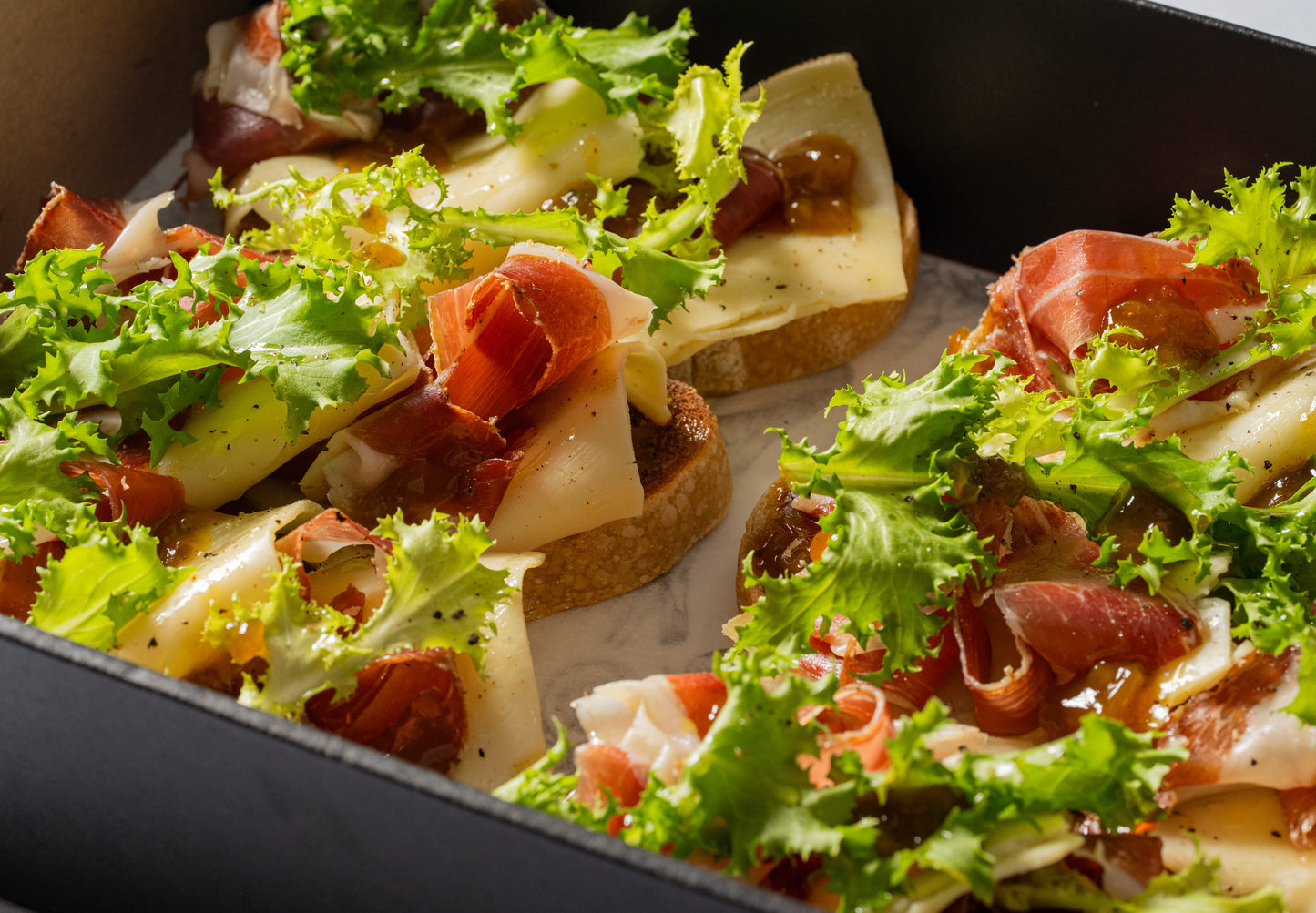 Prosciutto, gruyere & endive open sandwich